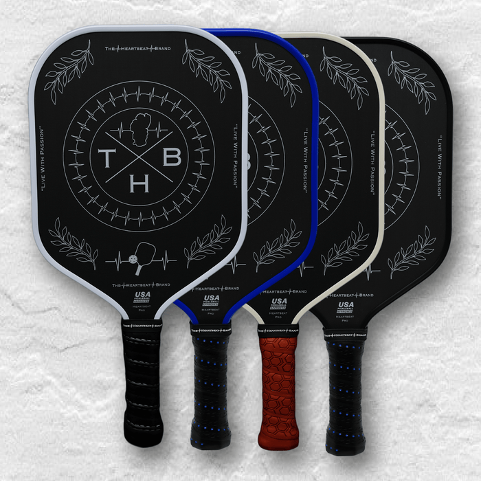 Image of pickleball paddles arranged in a square layout, without text, from The Heartbeat Brand